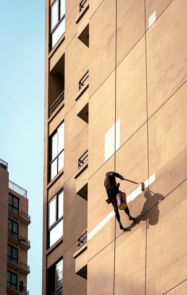 Man Painting a Building